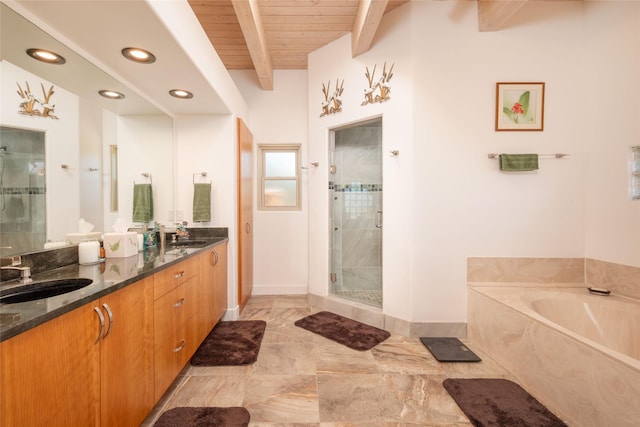 bathroom featuring double vanity, wooden ceiling, a sink, a garden tub, and beam ceiling