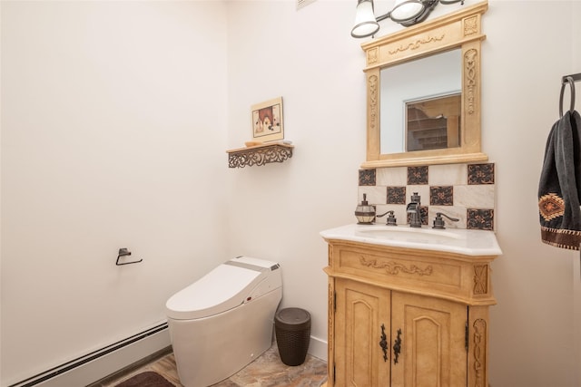 half bath featuring toilet, tasteful backsplash, a baseboard heating unit, and vanity