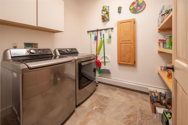 clothes washing area with cabinet space and washer and dryer