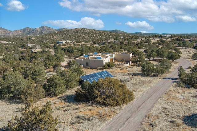 birds eye view of property with a mountain view