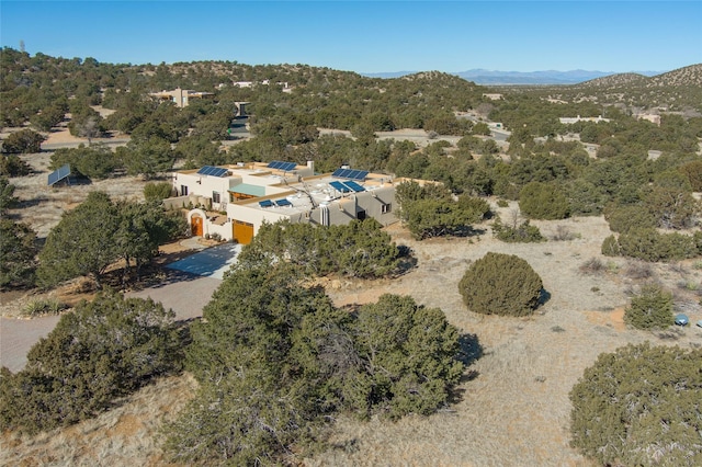 birds eye view of property with a mountain view