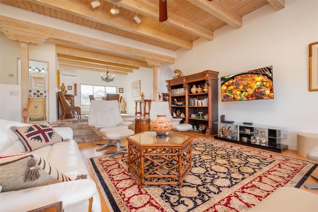 living room with beam ceiling, wood finished floors, wood ceiling, and an inviting chandelier