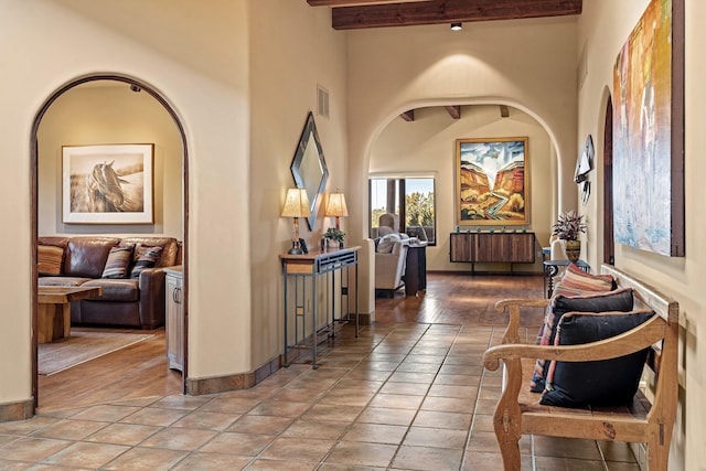972 Indian Ridge Rd, Santa Fe, NM 87501 - corridor with light tile patterned floors, baseboards, visible vents, and beam ceiling