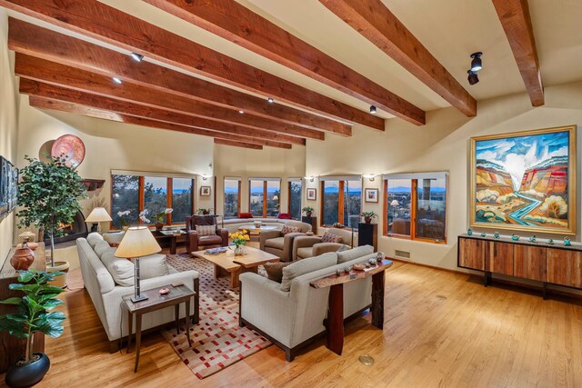 972 Indian Ridge Rd, Santa Fe, NM 87501 - interior space featuring light wood-type flooring, visible vents, and beam ceiling