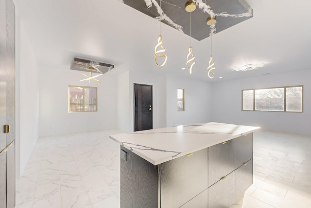 kitchen with modern cabinets, open floor plan, light countertops, and a center island