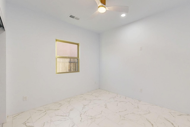 empty room featuring marble finish floor, ceiling fan, visible vents, and recessed lighting