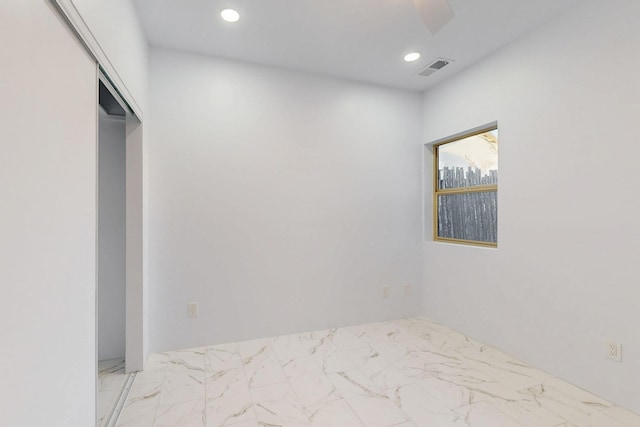 interior space featuring marble finish floor, visible vents, and recessed lighting