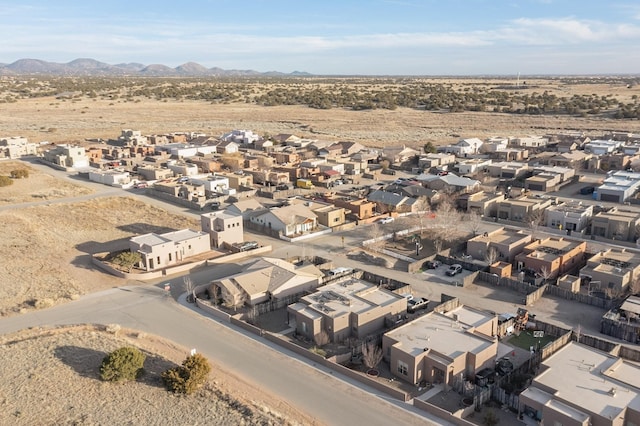 drone / aerial view featuring a residential view and a mountain view