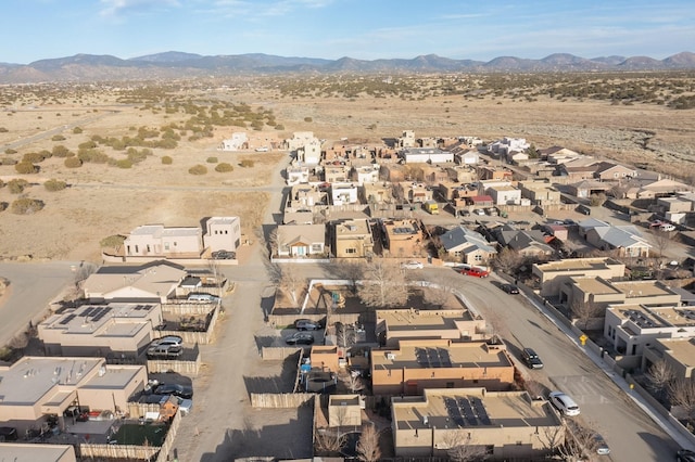 drone / aerial view featuring a residential view and a mountain view