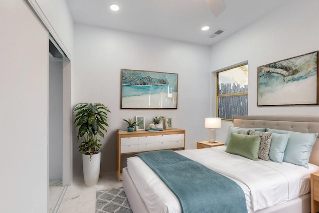 bedroom with marble finish floor, visible vents, and recessed lighting