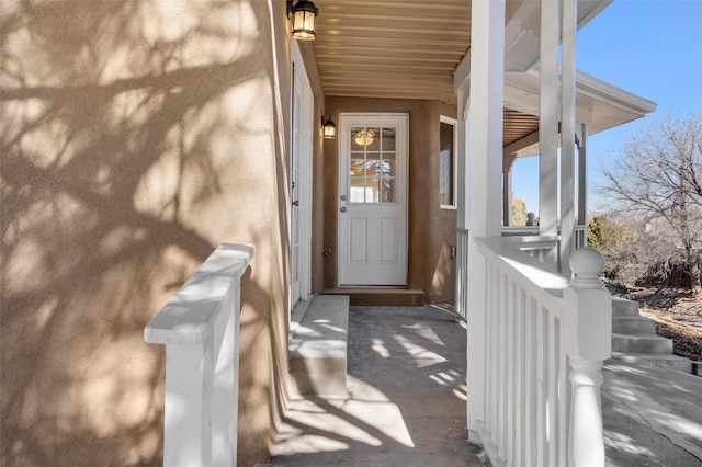 property entrance featuring stucco siding