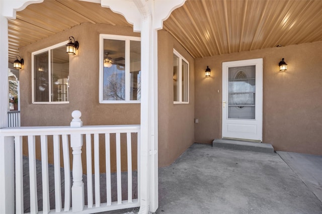 view of exterior entry featuring stucco siding