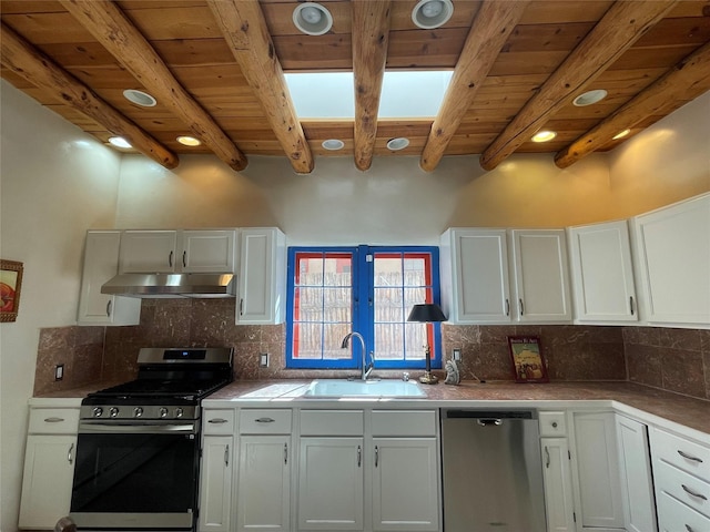 kitchen with appliances with stainless steel finishes, white cabinetry, and under cabinet range hood