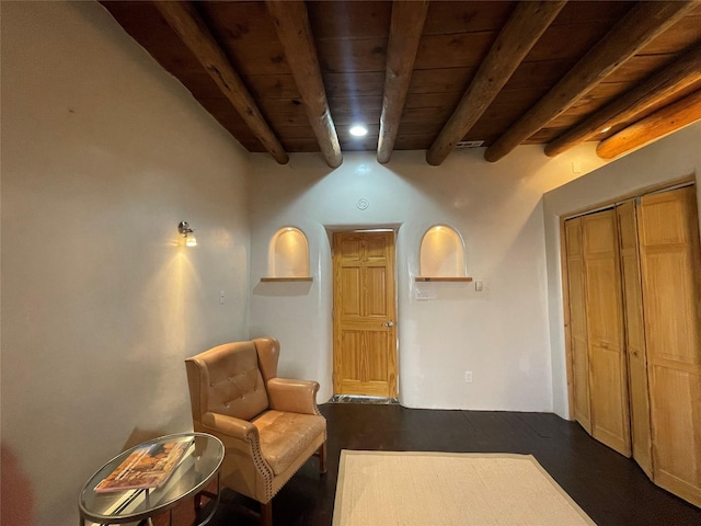 sitting room featuring wood ceiling, beam ceiling, and visible vents