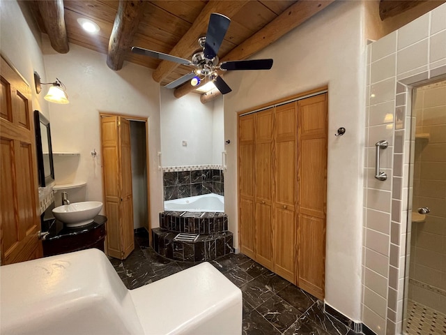 full bathroom featuring wood ceiling, beamed ceiling, marble finish floor, a garden tub, and a closet