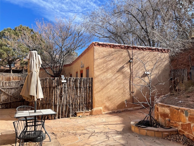 view of patio / terrace with outdoor dining area and fence