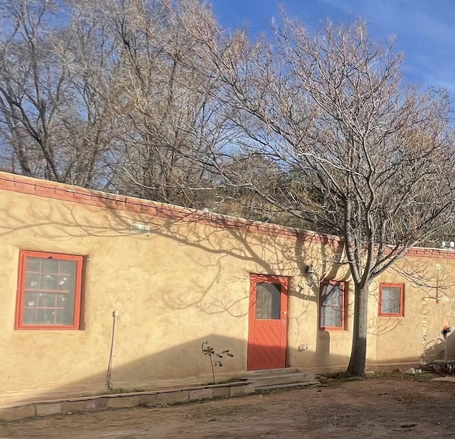 view of home's exterior with stucco siding