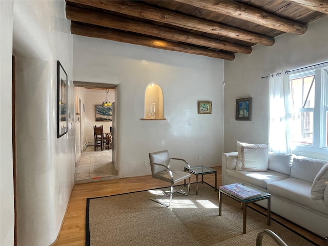 living room with light wood-style floors, wooden ceiling, and beam ceiling