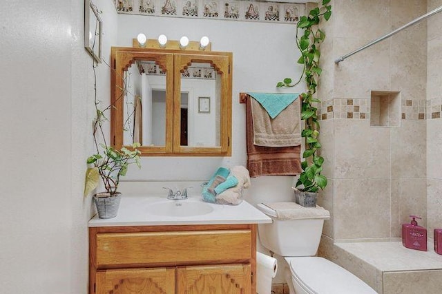 bathroom with toilet and vanity