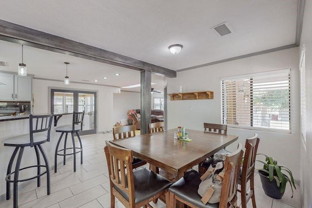 dining space with ornamental molding, french doors, light tile patterned floors, and visible vents