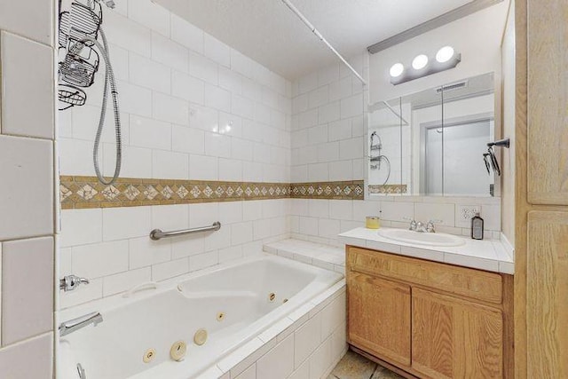 bathroom featuring backsplash, tile walls, and vanity