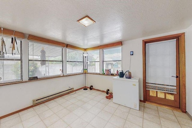 unfurnished sunroom with a baseboard radiator