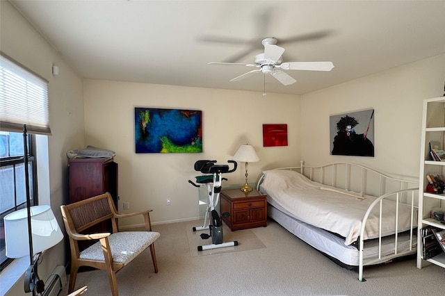 carpeted bedroom featuring ceiling fan and baseboards