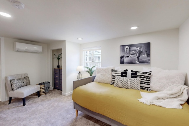 carpeted bedroom with an AC wall unit and recessed lighting