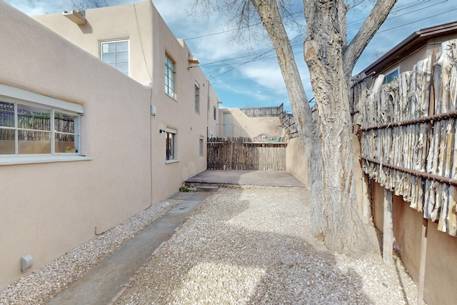 exterior space with fence private yard and a patio area