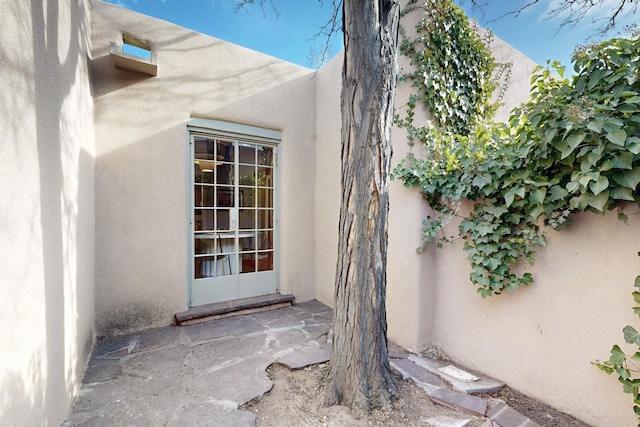 doorway to property with stucco siding