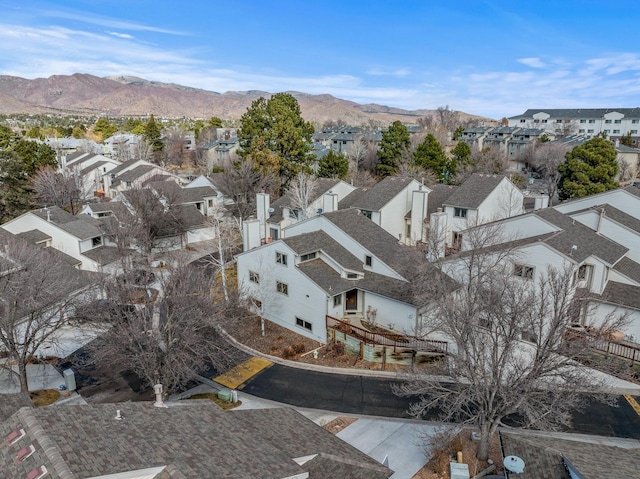 drone / aerial view featuring a residential view and a mountain view