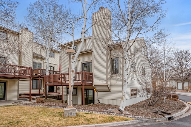 exterior space featuring a yard and a chimney