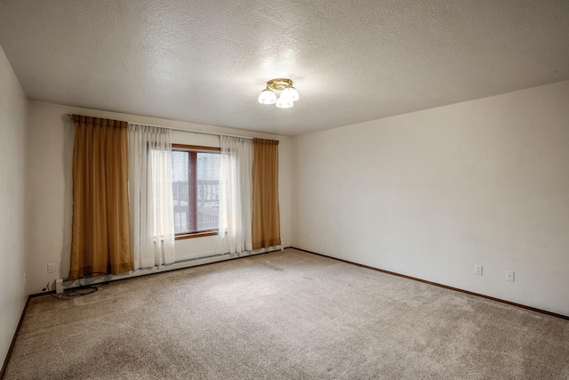 carpeted spare room featuring a baseboard radiator, a textured ceiling, and baseboards