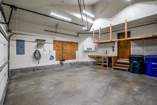 garage with electric panel and a garage door opener