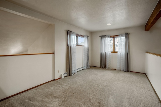 carpeted empty room with a baseboard radiator, baseboards, a textured ceiling, and beamed ceiling