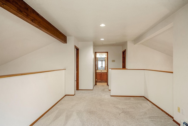 unfurnished room with recessed lighting, light carpet, lofted ceiling with beams, and baseboards