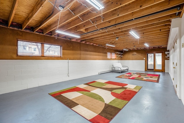 interior space with a garage and concrete block wall