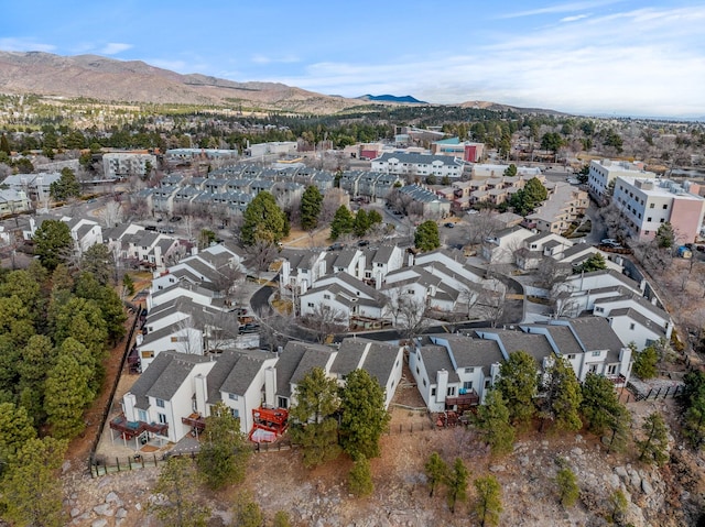 drone / aerial view featuring a residential view and a mountain view