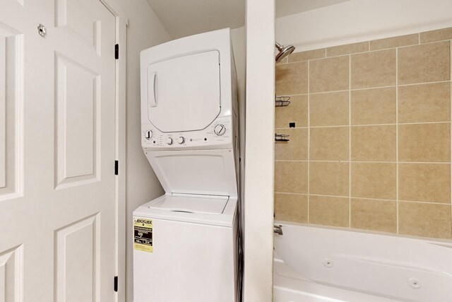 laundry room featuring laundry area and stacked washing maching and dryer