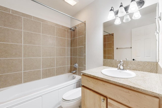 bathroom with toilet, shower / tub combination, and vanity