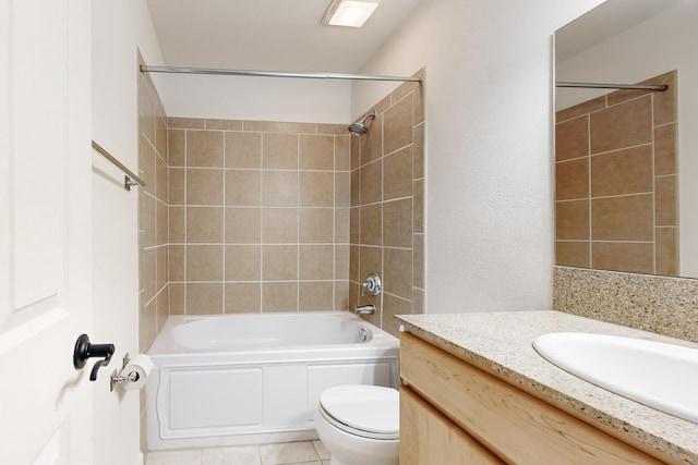 full bathroom with  shower combination, vanity, tile patterned flooring, and toilet