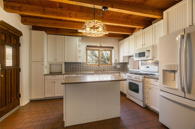 kitchen featuring decorative light fixtures, decorative backsplash, white cabinets, a kitchen island, and white appliances