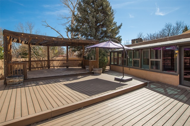 wooden deck featuring a pergola