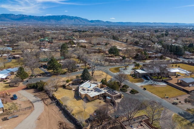 birds eye view of property featuring a mountain view