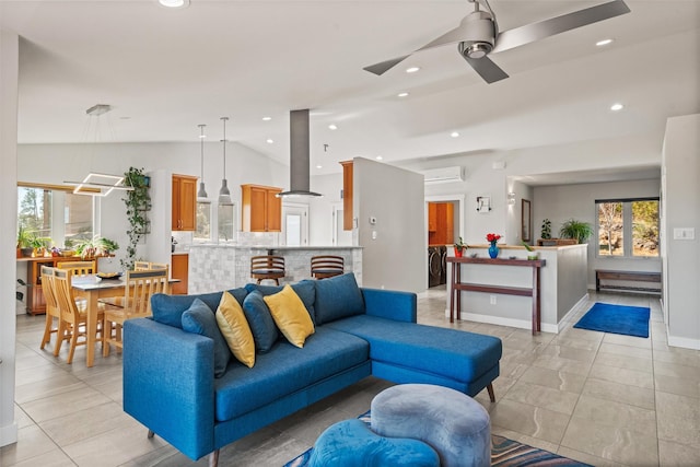 living area with lofted ceiling, a wall mounted AC, washer / clothes dryer, and recessed lighting