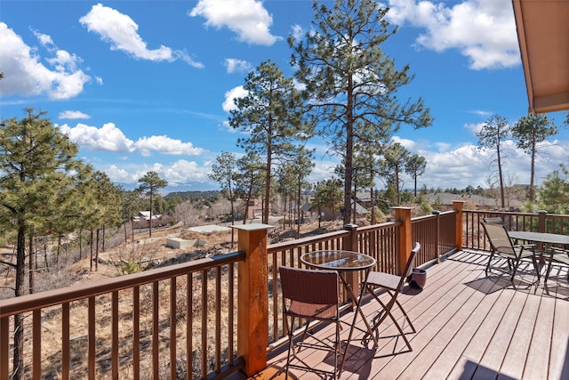 wooden deck with outdoor dining space