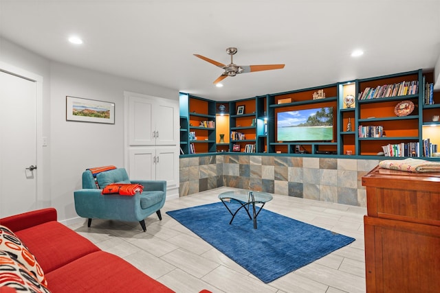 living room featuring a ceiling fan and recessed lighting