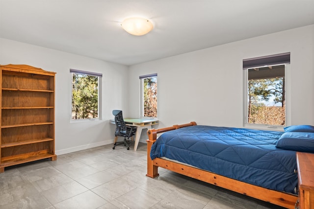 bedroom featuring baseboards