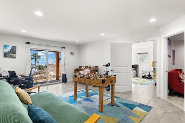 rec room featuring light tile patterned floors, baseboards, and recessed lighting