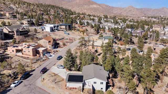 drone / aerial view with a residential view and a mountain view